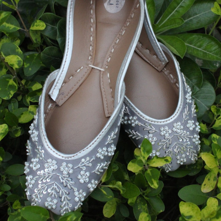 Grey Indian jutti shoes with white beads, silver french wire and silver sequins embellishment.