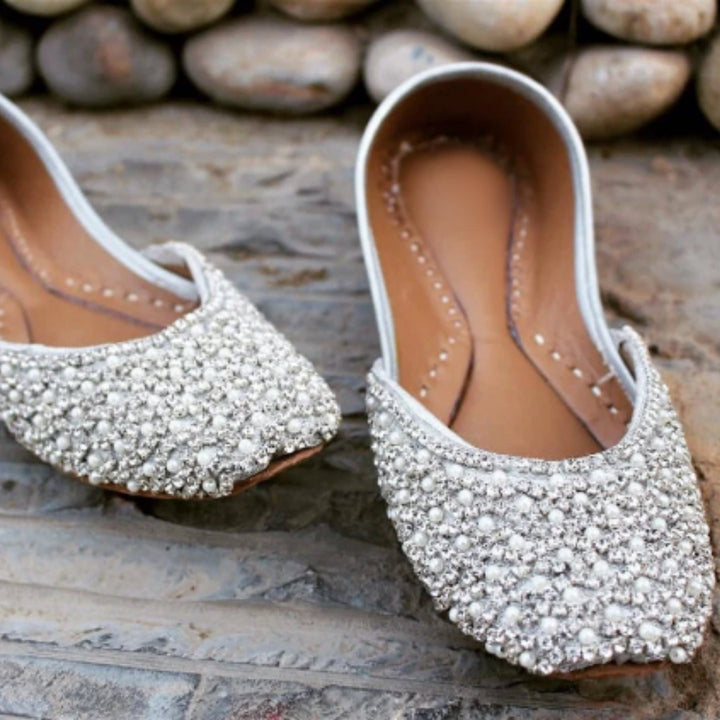 Bride&#39;s comfortable and stylish wedding shoes with pearl detailing