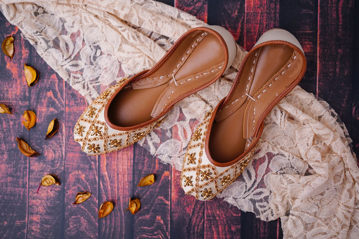 Ivory khussa shoes featuring gold dabka/ French wire, gold beads and gold sequins embellishment