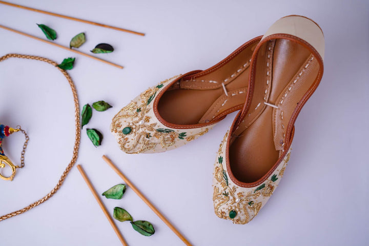 Ivory wedding flats with gold and green dabke, green and gold beads embellishment