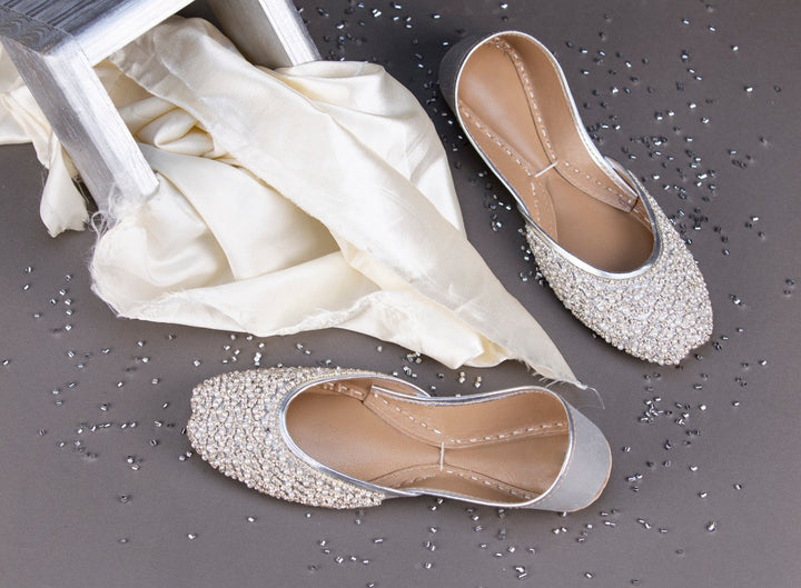 Silver bedazzled wedding flats with pearl and rhinestones embellishment.