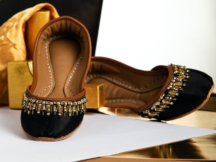 Black Pakistani Khussa with gold beads and gold rectangle sequins embellishments.