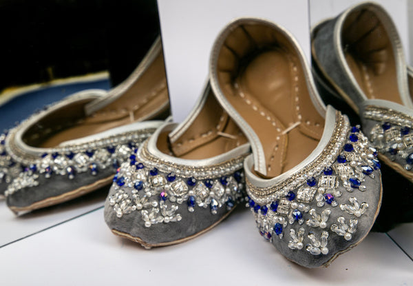 Grey Pakistani Khussa with embellishment of blue, clear and white beads and silver sequins.