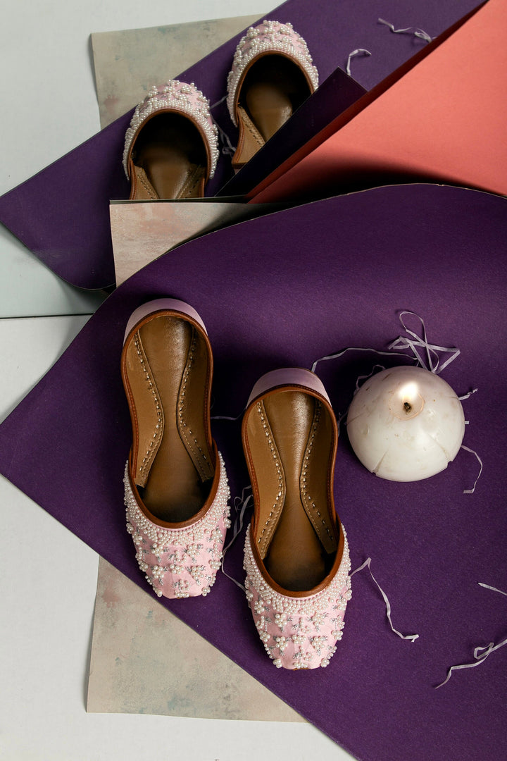 Pink ballerines with pearl embellishment and silver embroidery.