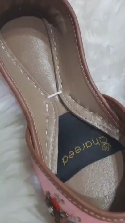 Video showcasing peach floral bridal flats with teal, orange and black beadwork, pearl accents and brown trim, highlighting the embellished satin jutti design from multiple angles.